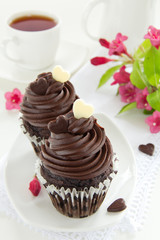 Chocolate muffins with chocolate cream.