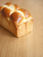 Bread loaf on wooden background