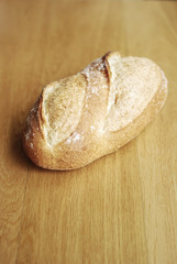 Bread loaf on wooden background