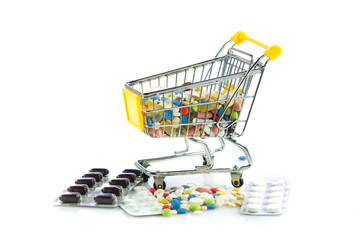 shopping trolley with pills isolated on white background