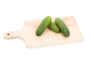Cucumbers on the carving board isolated