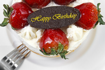 strawberry butter cream cake with birthday chocolate plate & for