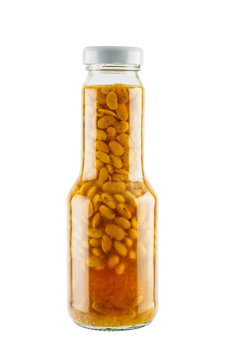 Salted soybean in glass bottle isolated on white background