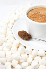 Closeup of cup of hot chocolate with small marshmallows resting