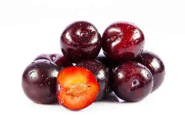 plums isolated on white background