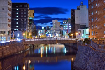Fototapeta premium Nagasaki, Japan downtown river scene