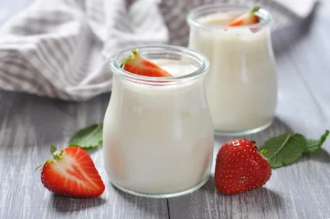 Foto op Plexiglas yogurt with ripe fresh strawberry © tashka2000