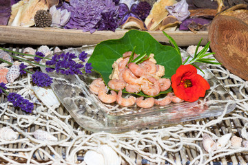 Serving of gourmet shrimps with herbs