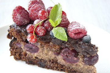 Chocolate cake with strawberry and raspberry and cherries