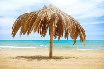 Fototapeta na wymiar Vacation Concept. Palapa Sun Roof Beach Umbrella