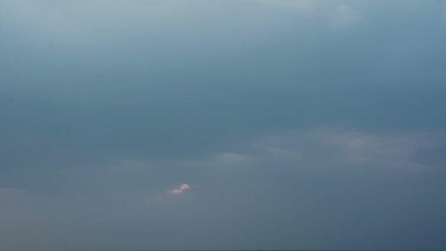 Clouds gathering above the sea at the evening. Time-lapse.
