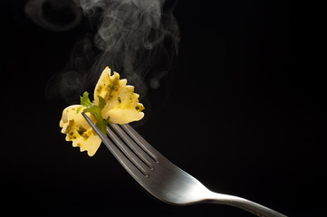 fork with farfalle pasta and ruccola
