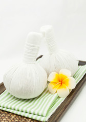 Obraz na płótnie Canvas Spa massage with thai herbal compress.