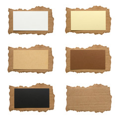 Collection of various ripped piece of cardboard on white