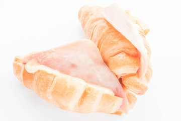 Couple of ham cheese croissants isolated on white background