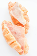 Croissants with ham cheese isolated on white background