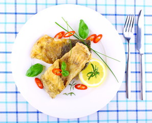 Fried fish fillets with lemon, chili peppers slice