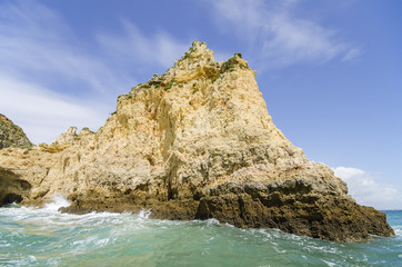 Naklejka premium Rock in the Ocean at Algarve coastline Portugal