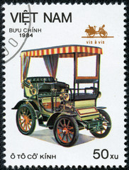 Fototapeta na wymiar stamp printed in the Vietnam, shows antique car