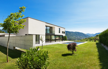 Fototapeta na wymiar Modern villa with pool, view from the garden