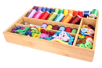 Fototapeta na wymiar Colorful threads for needlework in wooden box isolated on white