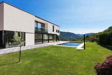 Modern villa with pool, view from the garden