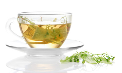 Glass cup of tea with linden isolated on white