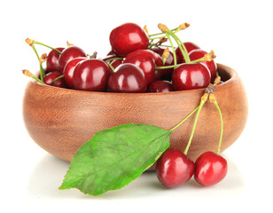 Cherry berries in bowl isolated on white