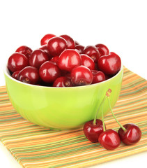 Cherry berries in bowl isolated on white