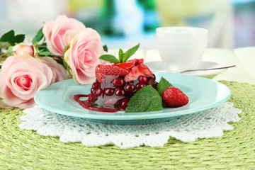 Tasty jelly dessert with fresh berries, on bright background