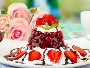 Tasty jelly dessert with fresh berries, on bright background