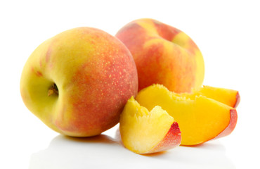 Ripe sweet peaches with leaves, isolated on white