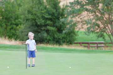 kid at the golf course