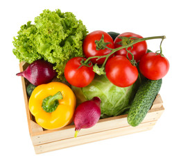 Fresh vegetables in wooden box on white background