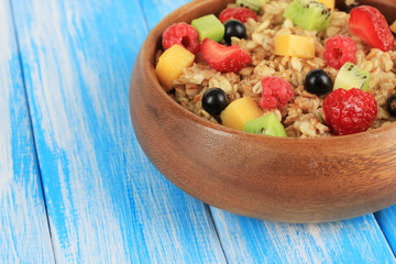Oatmeal with fruits on table close-up
