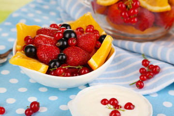 Useful fruit salad in glass cup and bowl