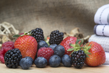 Fresh Summer berries in rustic kitchen setting