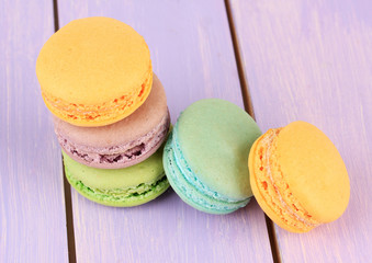 Macaroons on wooden table close-up
