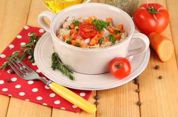 Delicious rice with vegetables and herbs in pot