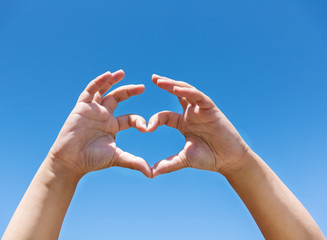 Children's hands showing sign of heart