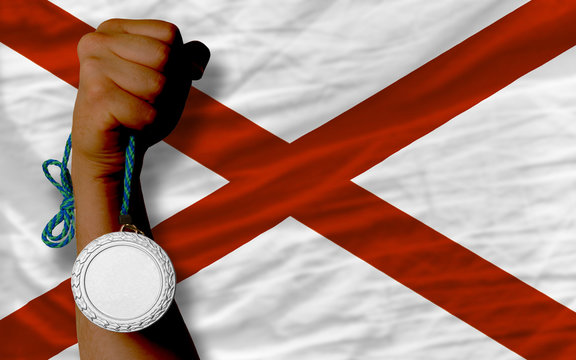 Silver medal for sport and flag of american state of alabama