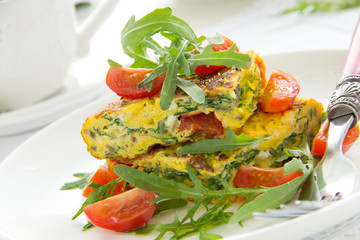 Omelet (Frittata) with tomatoes and herbs.