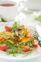 Omelet (Frittata) with tomatoes and herbs.