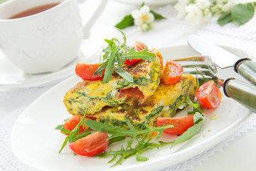 Omelet (Frittata) with tomatoes and herbs.