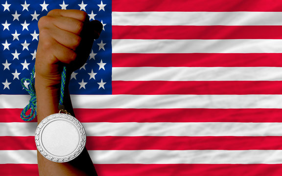 Silver medal for sport and national flag of america