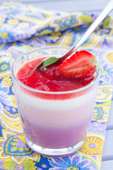 Panna cotta with strawberries and blueberries.