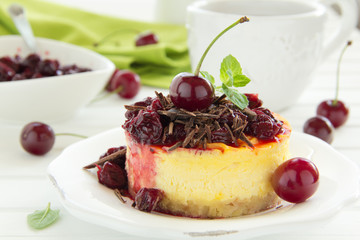 Cheesecake with cherries and chocolate.