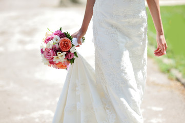 Wedding bouquet in hands of the bride