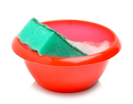 Red bowl and green sponge with foam