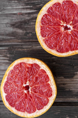 Fototapeta na wymiar red grapefruit on old table